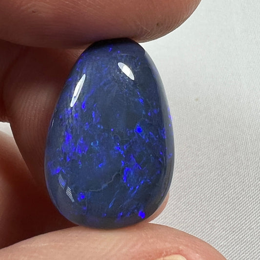 'Blue on black' solid black opal from Lightning Ridge. Perfect quality with awesome deep blue colour. This stone originated in the rough from the Tunnel Rats and was supplied to us from Phoenix Gems.