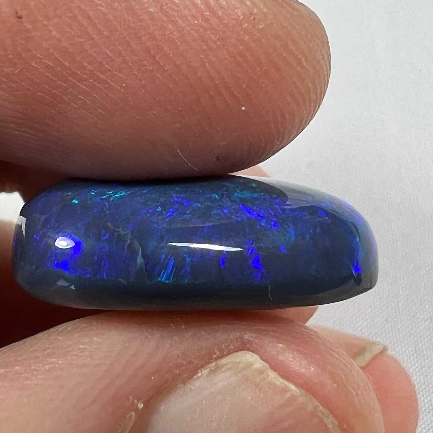 'Blue on black' solid black opal from Lightning Ridge. Perfect quality with awesome deep blue colour. This stone originated in the rough from the Tunnel Rats and was supplied to us from Phoenix Gems.