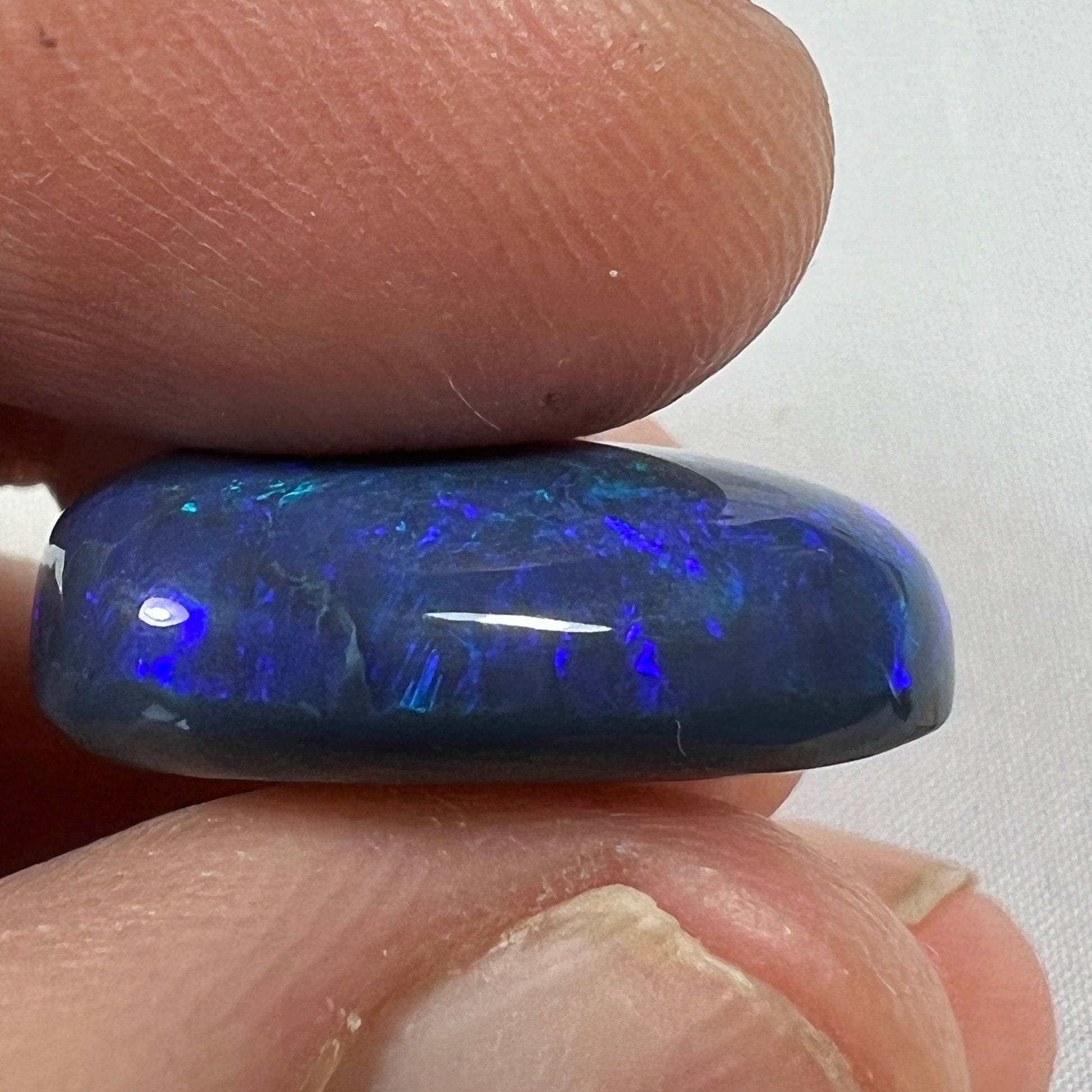 'Blue on black' solid black opal from Lightning Ridge. Perfect quality with awesome deep blue colour. This stone originated in the rough from the Tunnel Rats and was supplied to us from Phoenix Gems.