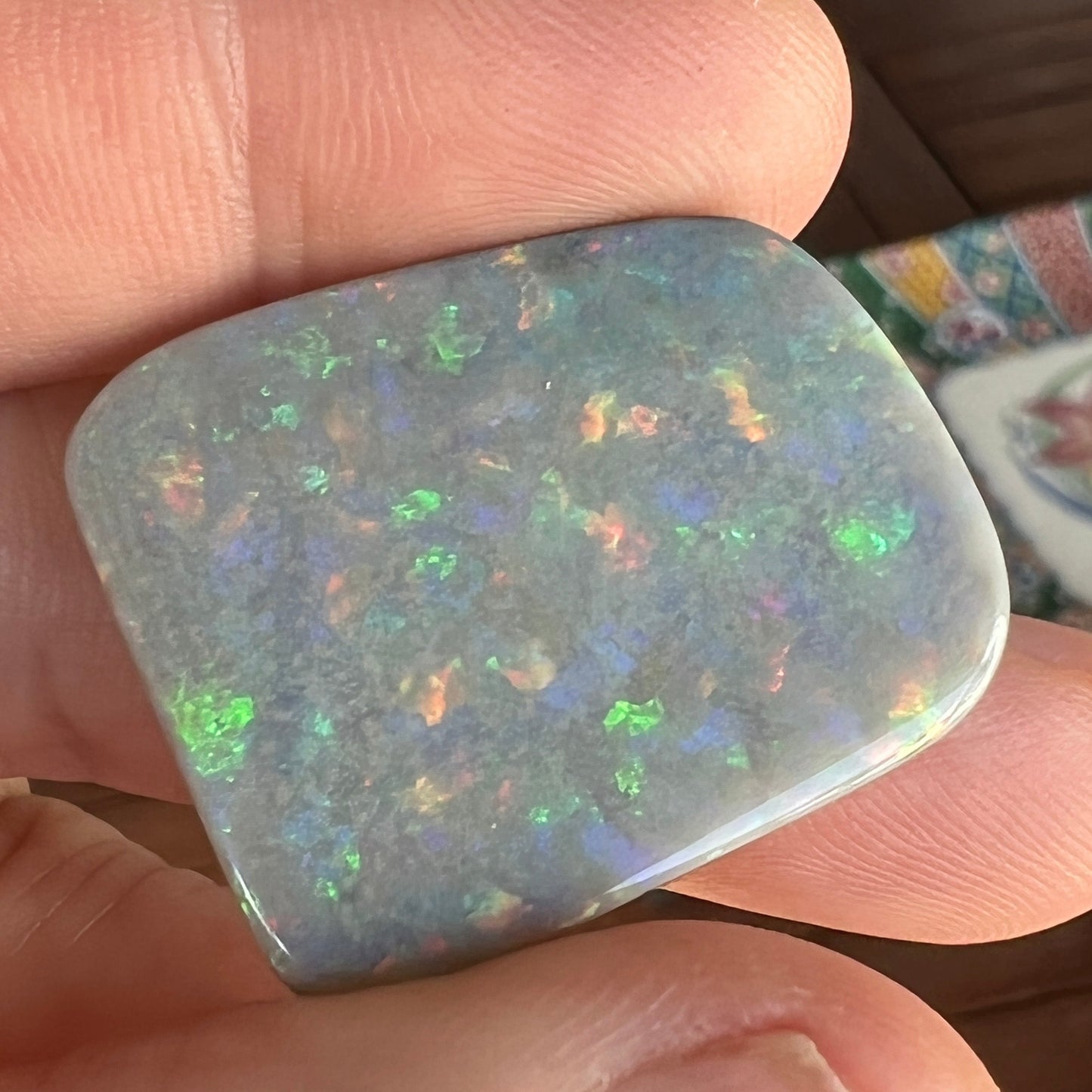 Lightning Ridge solid black opal, perfect pattern stone showing all colours. Outstanding cut and polish.