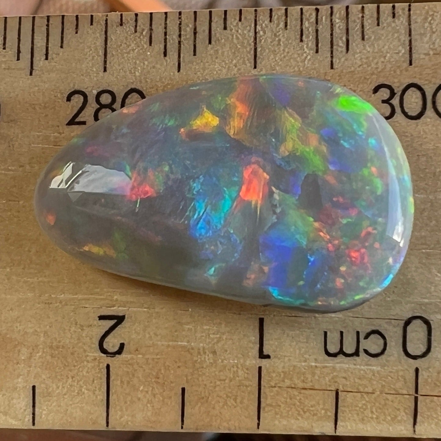 Solid Mintabie black opal. Beautiful specimen displaying a magnificent play of colour.