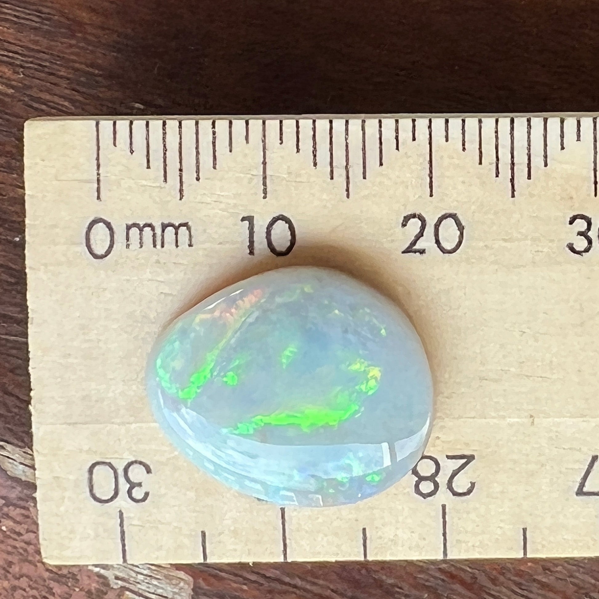 Rare Mintabie solid black opal, displaying vivid colours.