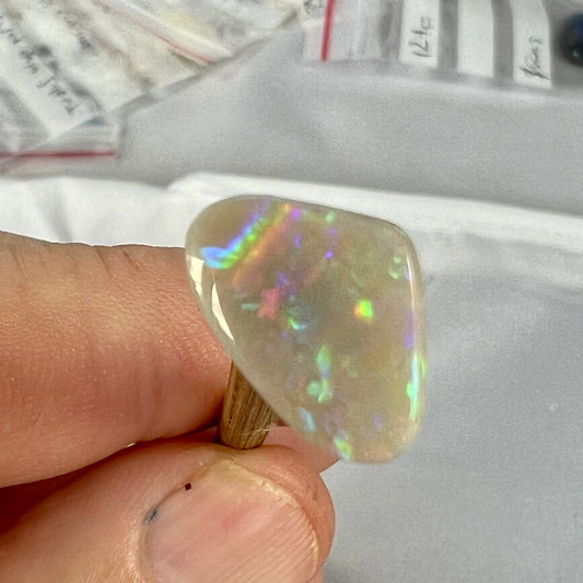 Nice semi black opal from Lightning Ridge, displaying brilliant flashes of colour.