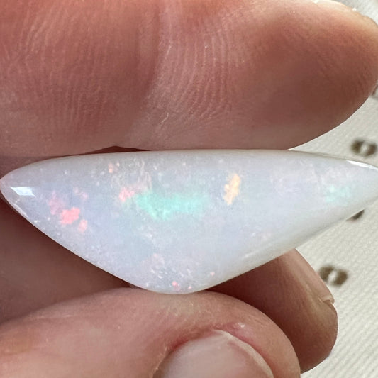 Nice piece of 19ct pin fire Coober Pedy opal, beautifully polished showing flashes of most colours. Polished by Bill Johnson.