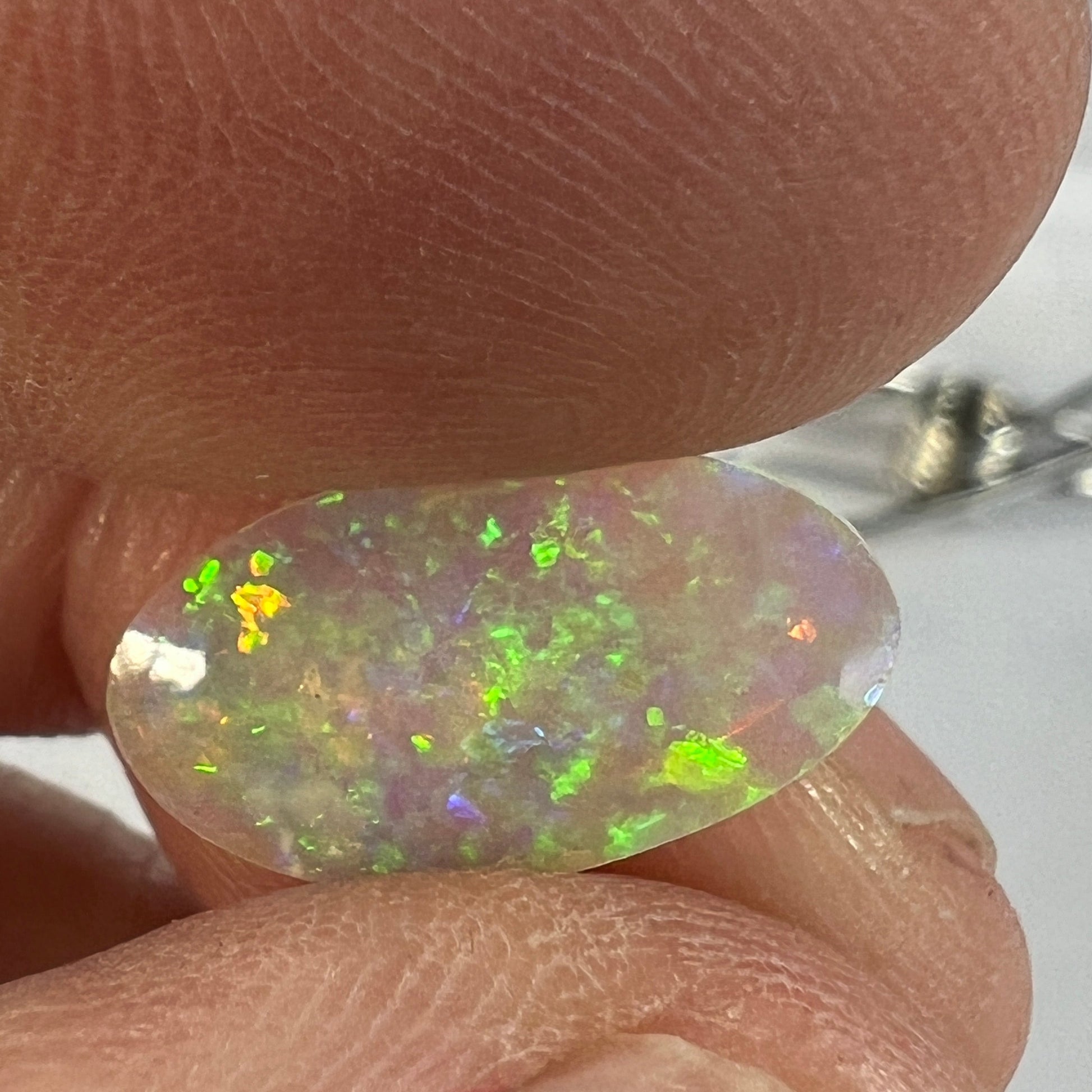 Perfect Lightning Ridge crystal opal displaying magnificent colours. Both sides are polished. Cut by Bill Johnston.