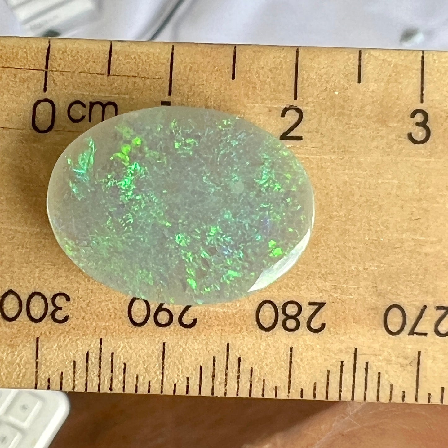 Beautifully shaped and polished solid black and green opal from Grawin, near Lightning Ridge.