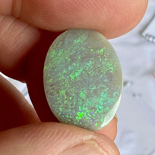 Beautifully shaped and polished solid black and green opal from Grawin, near Lightning Ridge.