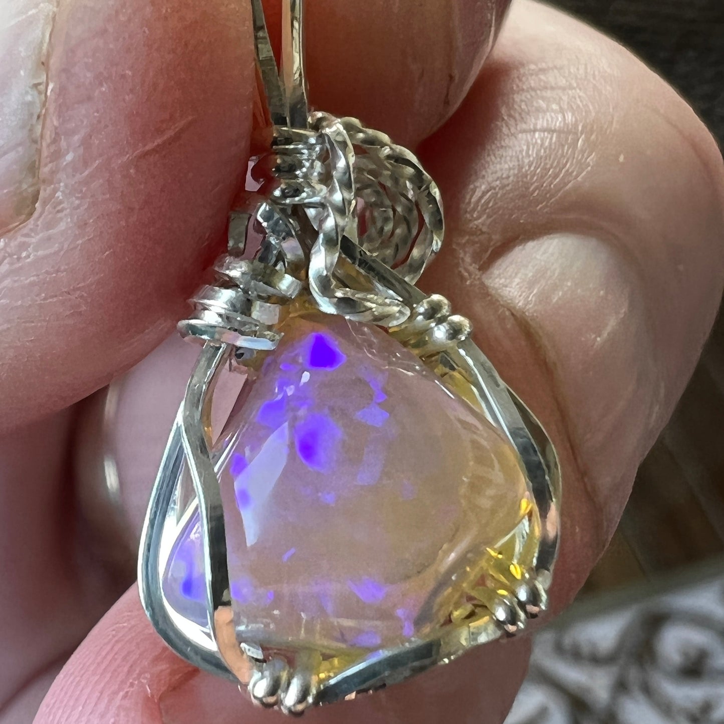 Beautifully cut Lightning Ridge Jelly Crystal opal. Cut and polished by Bill Johnson. Expertly set in a unique silver wire wrap. An awesome hand made gift.