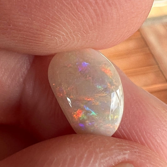 Lightning Ridge solid semi black opal. Awesome play of colours and beautifully polished.
