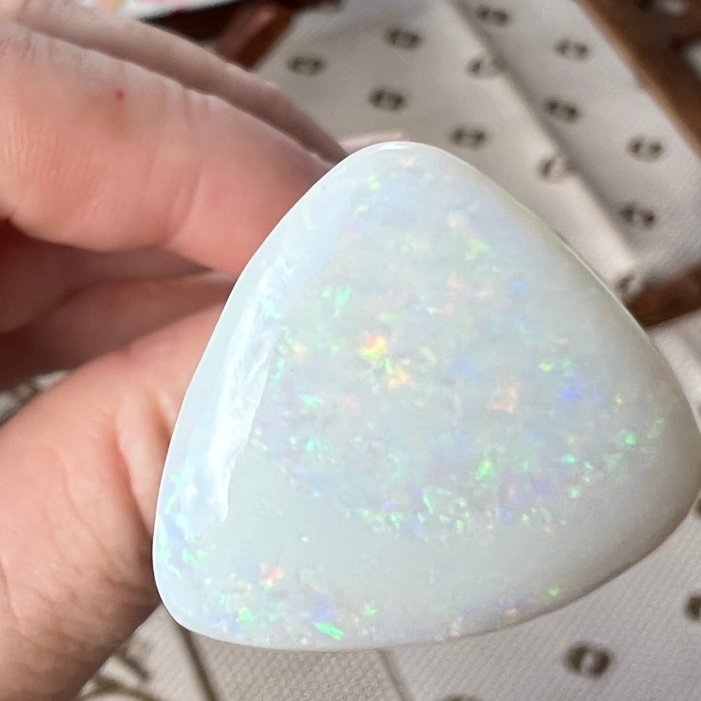 Coober Pedy solid white opal with Pin Fire colours. Quite large, and polished well, ready to make a pendant.