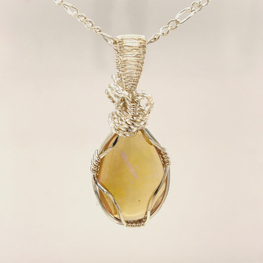 Beautifully cut Lightning Ridge Jelly Crystal opal. Cut and expertly polished by Bill Johnson and set in a unique silver wire wrap. An awesome hand made gift.