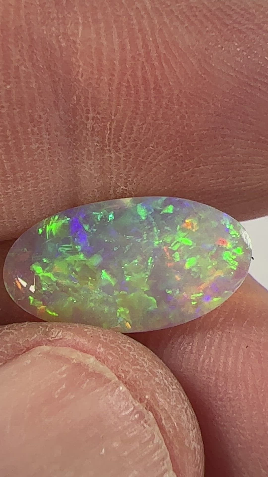 Perfect Lightning Ridge crystal opal displaying magnificent colours. Both sides are polished. Cut by Bill Johnston.