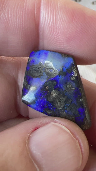 An unusual shaped piece of Winton boulder opal, showing beautiful blues.