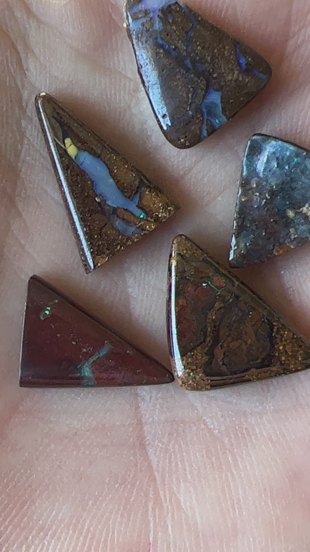 Nice boulder opal bundle from Winton in great triangular shapes. Lovely colours in all six stones.