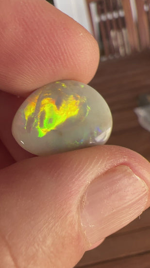 Rare Mintabie solid black opal, displaying vivid colours.