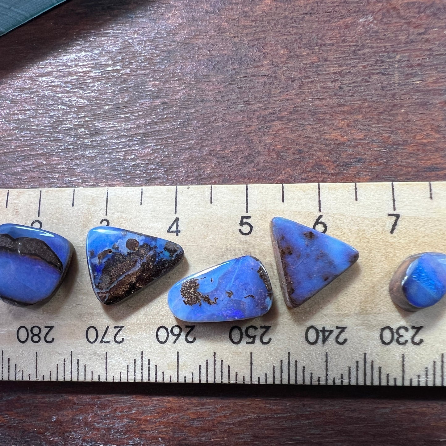 Five lovely pieces of Winton boulder opal. Nice blues and lovely polish.