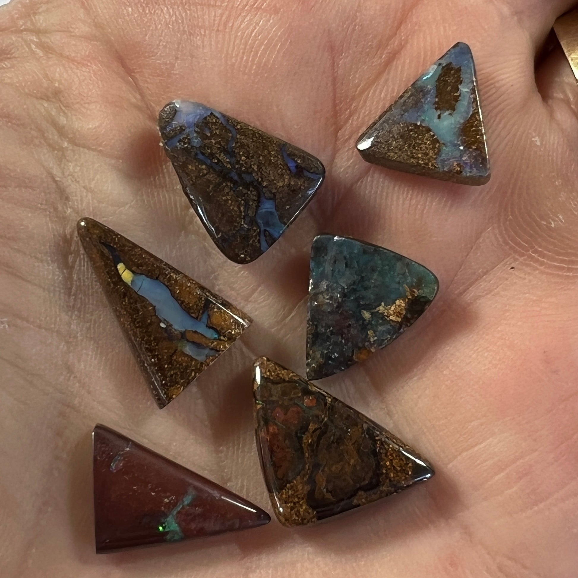 Nice boulder opal bundle from Winton in great triangular shapes. Lovely colours in all six stones.