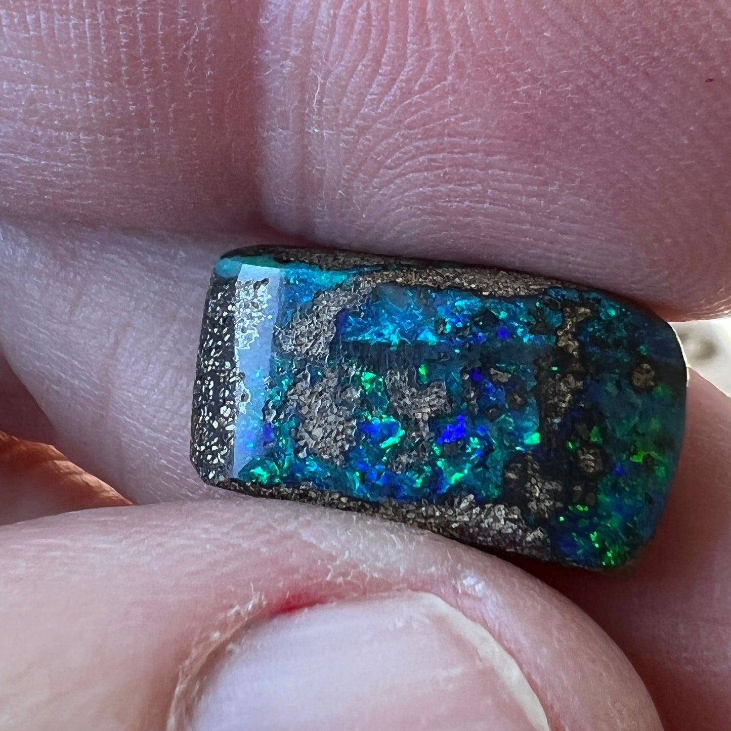 Nice greens and blues are shown within this lovely Winton boulder opal.