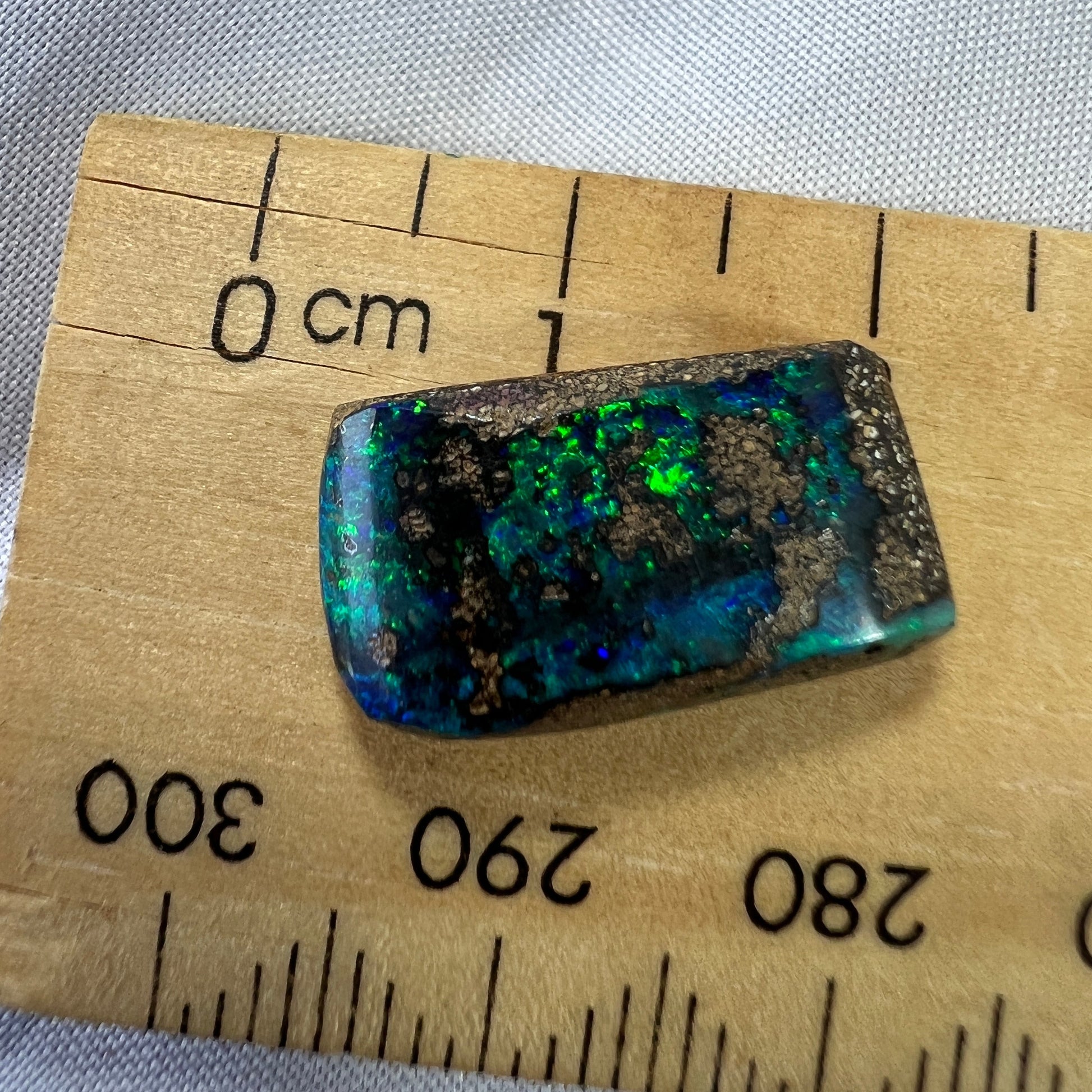 Nice greens and blues are shown within this lovely Winton boulder opal.