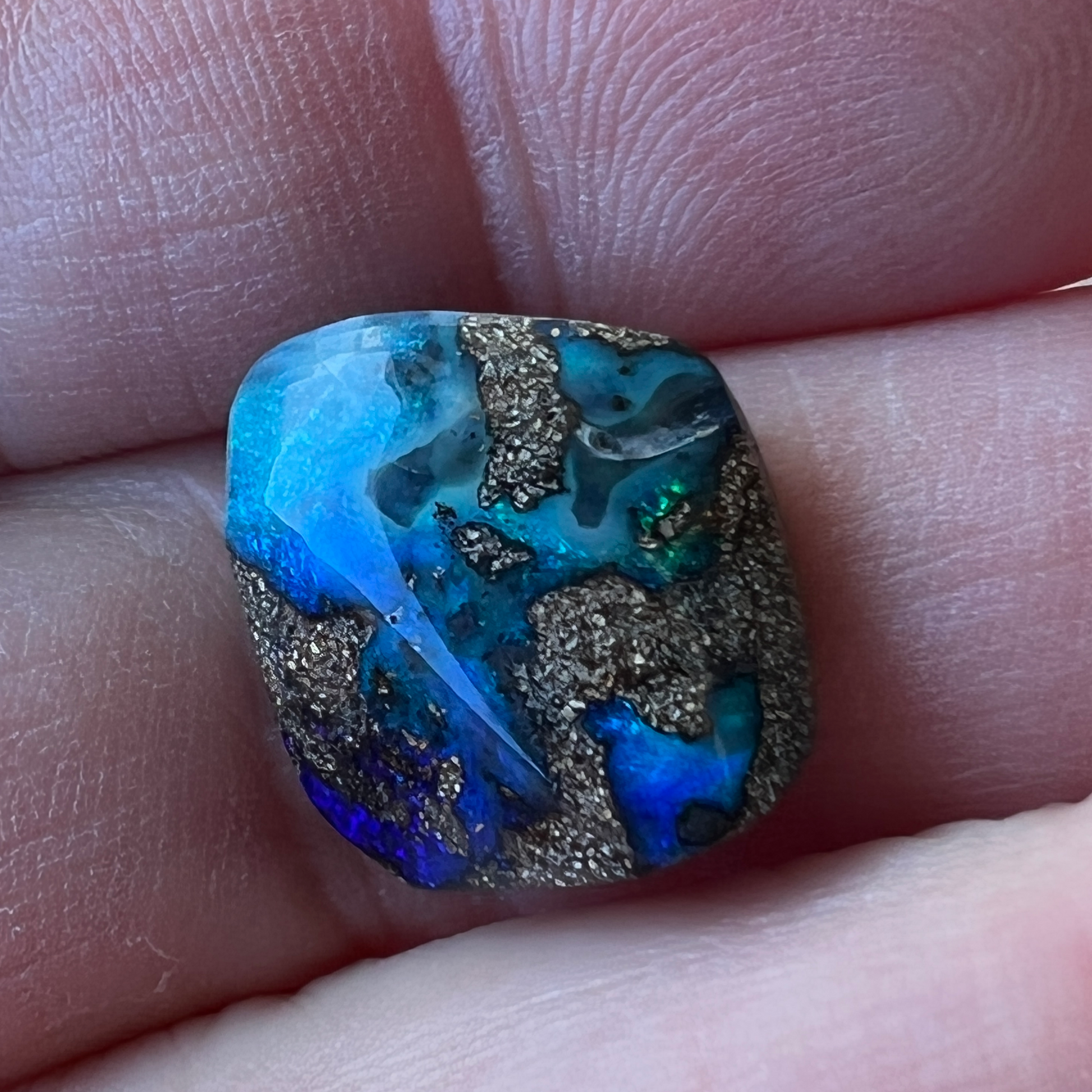 Beautiful greens and blues are displayed in this nice piece of Queensland boulder opal.