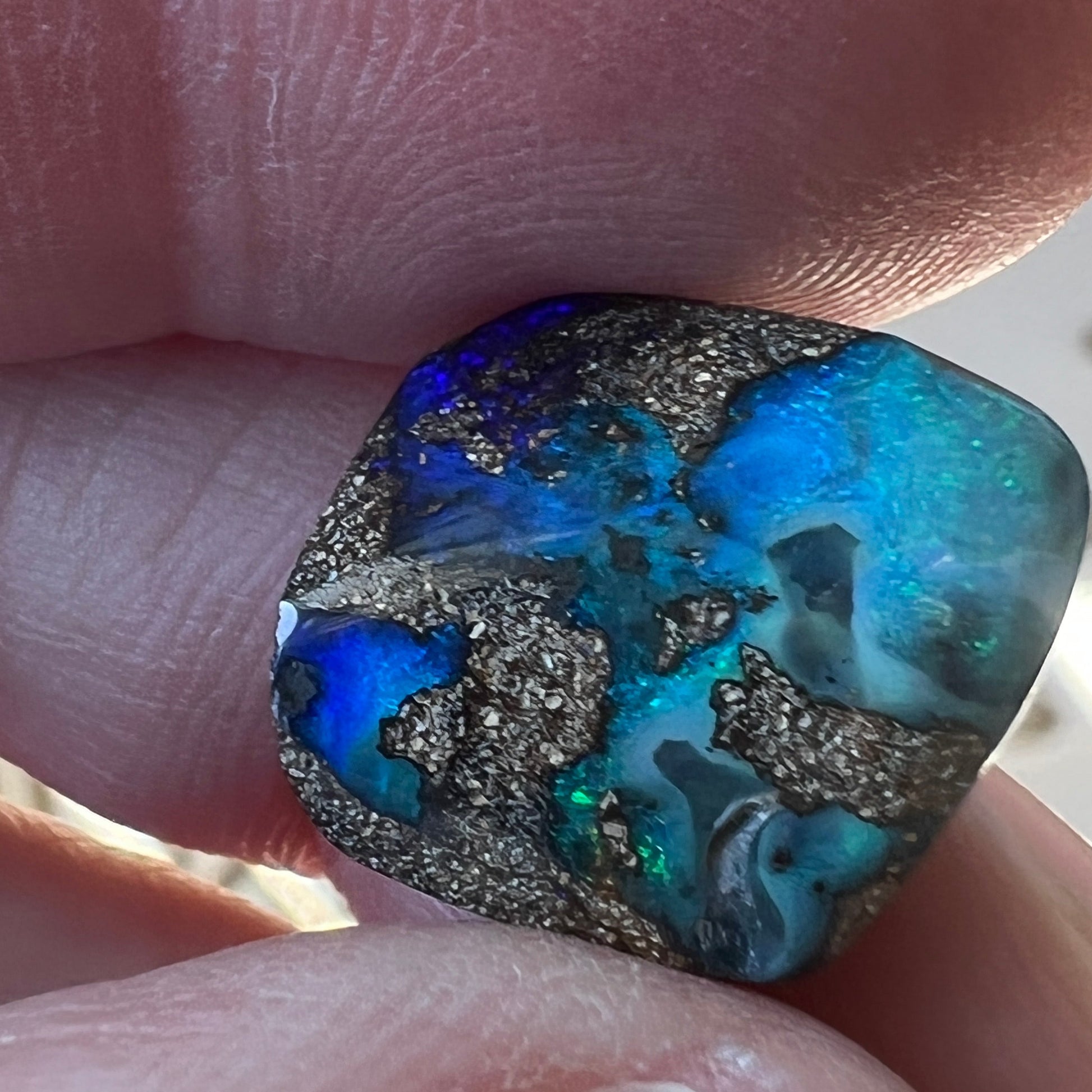 Beautiful greens and blues are displayed in this nice piece of Queensland boulder opal.