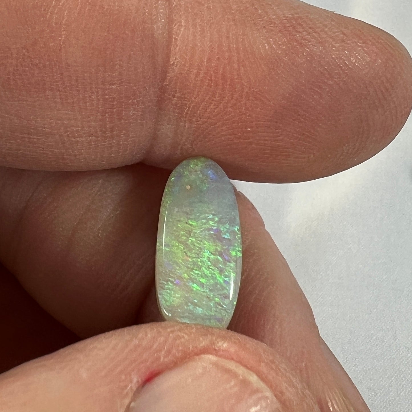 Lightning Ridge grey/green solid opal. Slight sand spot, should rub out, hence the discounted price.